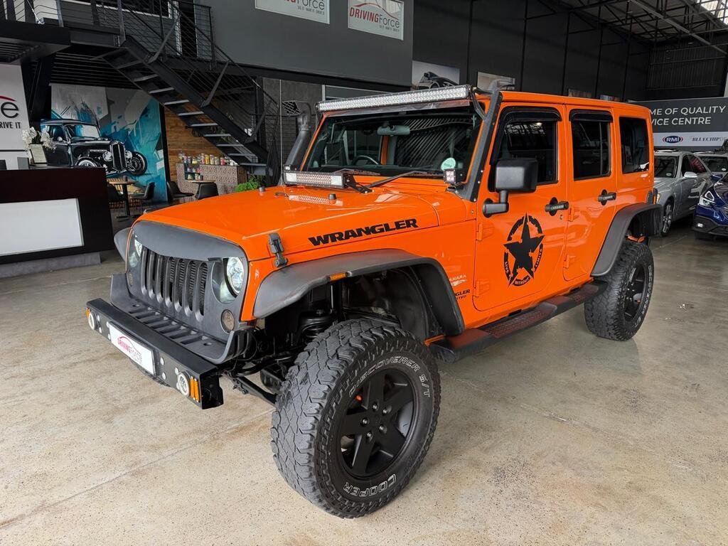 2012 Jeep Wrangler Unlimited Sahara WRANGLER UNLTD SAHARA 3.6L V6 A/T in Orange, for sale at Driving Force Cape Town